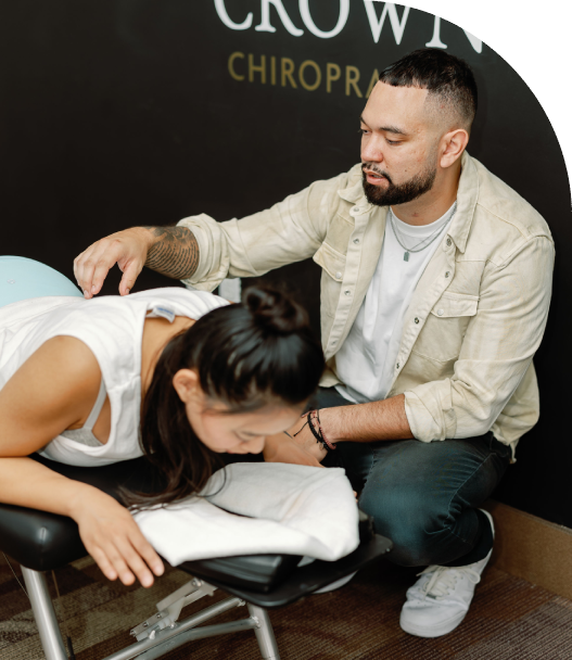 Group-106 Chiropractor examining lady patient's back