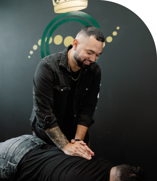 Group1 Chiropractor examining patient's back