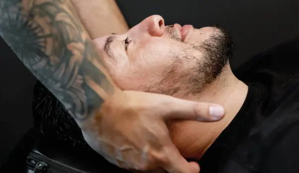 Chiropractor examining patient's neck and head